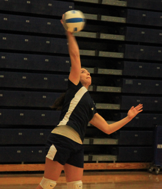 Megan Rehder gets the match started by making the opening serve as Summit played Deary at District on Saturday.