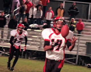 Tyler Hankerson is about to catch a pass. In the background is Tanner Ross.