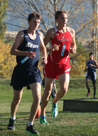 Peter Spencer, right, qualified for state at the district crosscountry meet last Thursday at Grangeville. Photo by Steve Wherry
