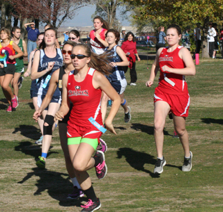 Sky Wilson, in sunglasses, and Sydney Glimp at the District Crosscountry race at Grangeville last Thursday. Photo by Steve Wherry.