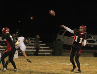 Jake Bruner throws a pass on Prairies first offensive play against Potlatch. Isaiah Shears wound up catching the ball for a touchdown. At left is Rhett Schlader.