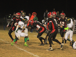 Mason Dalgliesh (2) carries the ball for a substantial gain. Others shown from left are Isaiah Shears (4), Rhett Schlader (7), Westin Crenshaw and Matt Schwartz (42).