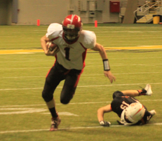 Lucas Arnzen breaks away from a Troy tackler. He wound up getting stopped at the 2 with Calvin Hinkelman scoring on the next play.