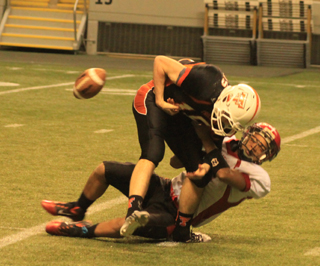 The ball comes loose as Tyler Hankerson tackles Troys Cody Self. Matt Schwartz wound up recovering the ball.