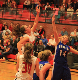Hailey Danly puts up a shot against Orofino. #30 is Krystin Uhlenkott.