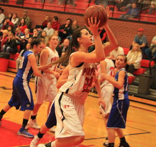 Kyndahl Ulmer goes for a lay-up against Orofino. She was named the MVP of the Lakeside Turkey Shootout over the weekend. In the background are Keely Schmidt and Hailey Danly.