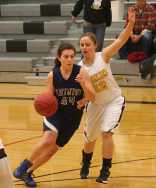Summits Megan Rehder drives past a Highland defender during their game last Tuesday. Photo by Steve Wherry.
