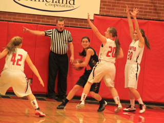 Hailey Danly, 20, and Krystin Uhlenkott double team Kendrick in the low post. At left is Sky Wilson.