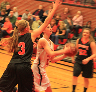 Kyndahl Ulmer gets the ball on the low block against Kendrick and is about to score.