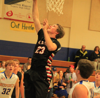 Lucas Arnzen scores 2 of his team high 16 points at Nezperce. Nearly all of his 7 baskets were lay-ups.