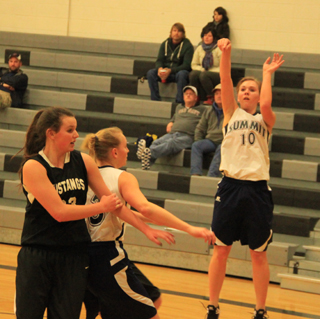 Summits Sarah Chmelik shoots as Ally Hale battles in the post against Deary.