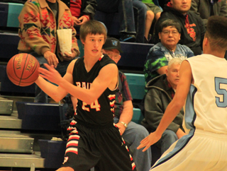 A wide-eyed Dylon Bruegeman looks to make a pass in the Lapwai game.