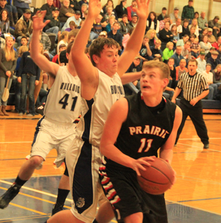 Jake Bruner was back in action for the Pirates after sitting out Decembers games with a broken collarbone. Here he looks for an opening at Grangeville.