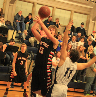 Tanner Ross goes for a lay-up at Grangeville as Bryson Higgins watches.