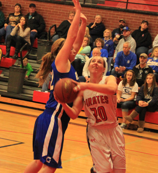 Hailey Danly tries to go under and around a Genesee defender for a shot at the basket.