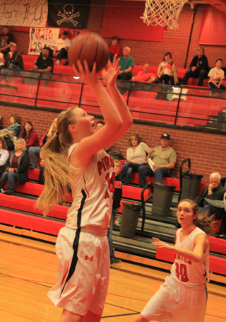 Kayla Schumacher has a wide open look for a lay-up against C.V. Also shown is Krystin Uhlenkott.