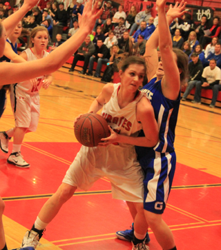 Kyndahl Ulmer battles underneath for a shot. At left is Nicole Wemhoff.