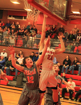 Lucas Arnzen scores a lay-up against Troy.