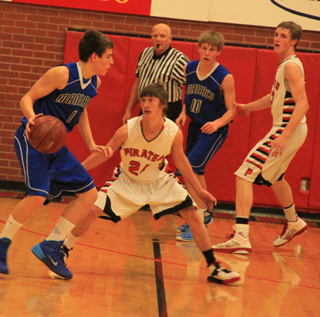 Dylon Bruegeman and Lucas Arnzen play defense against Orofino.