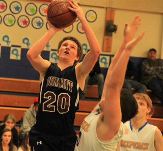 Josh Lustig shoots inside the lane against Nezperce.