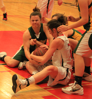Kyndahl Ulmer battles for a loose ball against Potlatch.