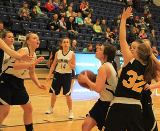 Megan Rehder splits a pair of Highland defenders and looks to score. Also shown from left are Rachael Frei, Ally Hale and Rachel Waters.