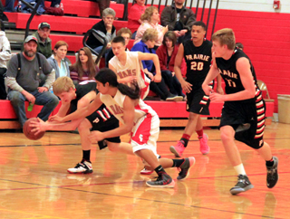 Rhett Schlader steals the ball at C.V. Also shown are Tyler Hankerson and Jake Bruner.