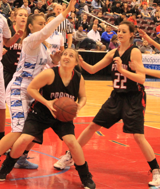 Hailey Danly looks for an opening against Lapwai in the state championship game. Also shown are Keely Schmidt and Kyndahl Ulmer.