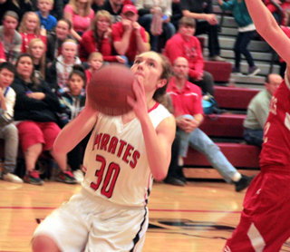 Krystin Uhlenkott goes for a lay-up against Grace. She scored a couple of big baskets when Kyndahl Ulmer was out with foul trouble in the third quarter against Grace.