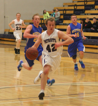 Matthew Schwartz races downcourt ahead of Nezperce defenders. In the background is Nathan Beckman. Summit game photos by Steve Wherry.