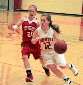 Nicole Wemhoff drives past a Grace defender. She did a great job handling the ball against the full court pressure defense both Grace and Lapwai used.