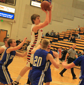 Tanner Ross got way up over the defense for 2 of his 10 points against Genesee. Partially hidden at left is Dylon Bruegeman.