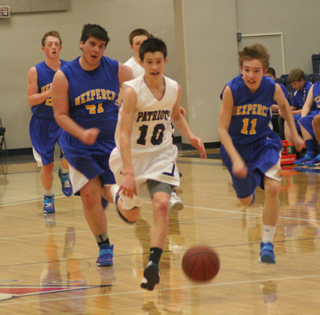 Tyler Krogh leaves Nezperce defenders in his wake at District. In the background is Josh Lustig.