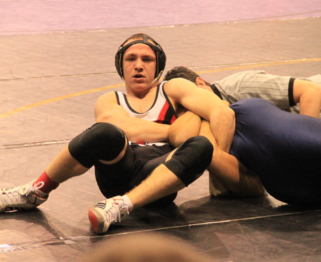 Hunter McWilliams couldnt quite get the pin against Armando Jimenez of Wendell but the near fall points he got with this double arm bar helped him clinch a state medal.