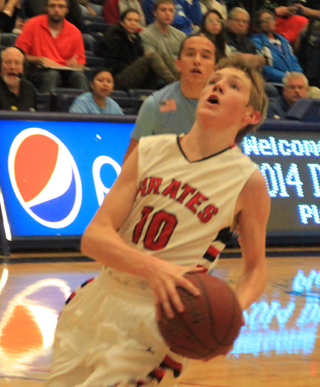Jared Higgins goes for a lay-up after a steal at midcourt off a bad pass forced by Jake Bruner.