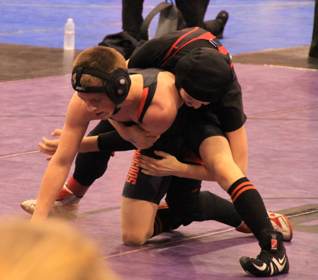 Kellie Heitman tries to cinch up a cradle in this second round match but wound up getting eliminated by Dallin Atkison of Malad.