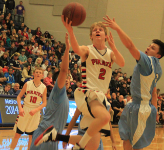 Rhett Schlader goes for a shot in the District Championship game against Lapwai. In the background is Jared Higgins.
