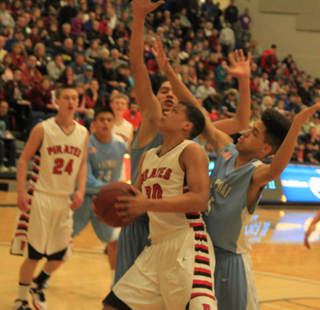 Tyler Hankerson looks to get a shot up inside against Lapwai. 24 is Dylon Bruegeman.