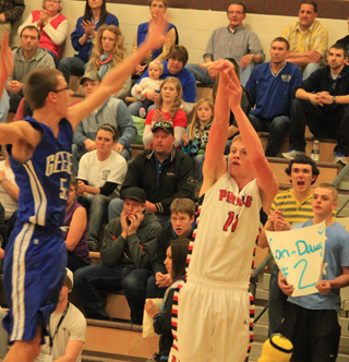 Jake Bruner puts up an outside shot in the Genesee game. He got Prairie off to a great start in the second half scoring the first 10 points as Prairie turned a 3-point halftime lead into a double digit lead quickly.
