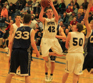 Matthew Schwartz found an open spot for this shot against Ambrose. Open shots were pretty rare in this game. At left is Michael Waters while at right is Chris Osborne.