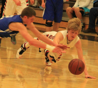 After knocking the ball loose, Rhett Schlader dives after it in the Genesee game.