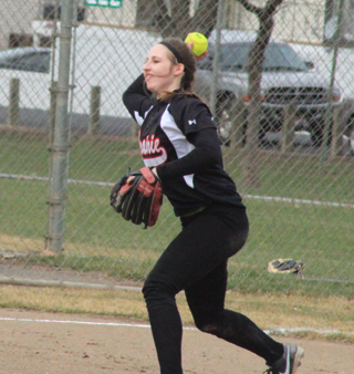 Hailey Danly gets ready to gun a batter out at first after fielding a grounder at shortstop.