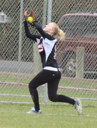 Kellie Heitman makes a running catch in left field.