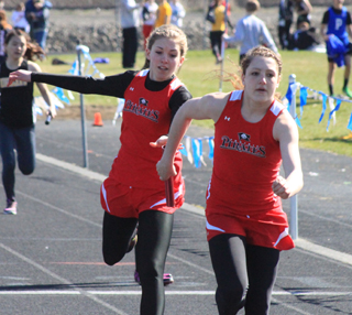 Chaye Uptmor hands off to Shayla VonBargen in the 4x200 relay at the Central Idaho Invitational at Lapwai.