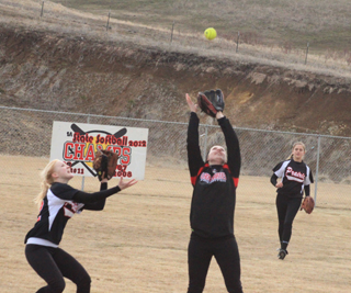 Hailie Danly raced into the outfield from shortstop to catch this high fly ball against McCall. At left is leftfielder Kellie Heitman while at right is centerfielder Kylie Tidwell.