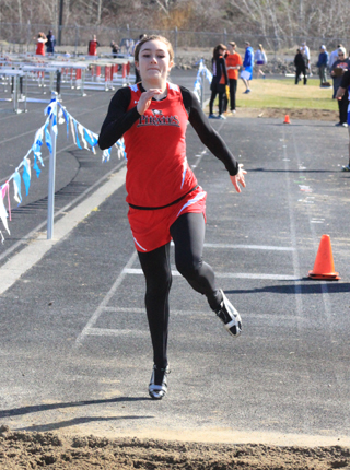 Krystin Uhlenkott makes the final takeoff on a triple jump. She placed 2nd in the event at Lapwai Saturday.