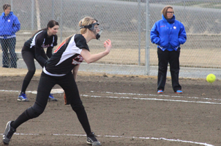 Leah Holthaus puts some torque on a pitch against McCall-Donelly. Hanna Ross can be seen playing first base.