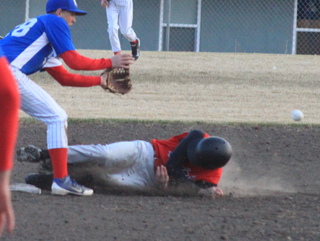 Rhett Schlader slides into second against McCall with a stolen base.