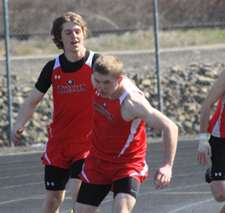 Westin Crenshaw hands off to Drew Cochran in the Throwers Relay Saturday at Lapwai.