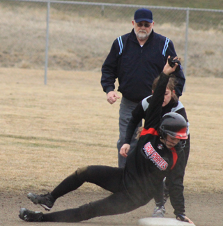 Sky Wilson hangs on to second after nearly oversliding the bag on a successful stolen base attempt against Troy.